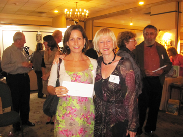 Eve Waltermaurer (l), president of the Rosendale Theatre Collective board, accepting the award on behalf of the theatre from Barbara Cohen (r), Chairperson of Fall for Art